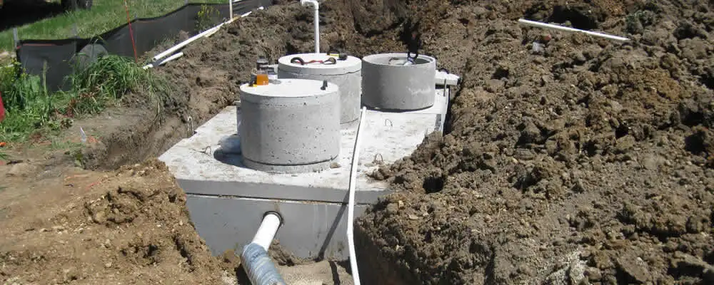 Septic system repair and installation site with tank access ports in Hartford, CT