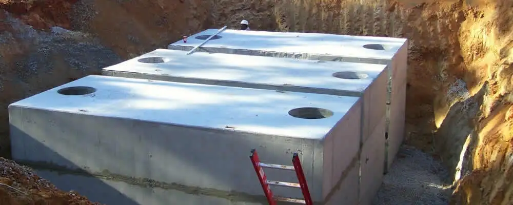 Septic tank installation site with a newly placed concrete tank in Hartford, CT